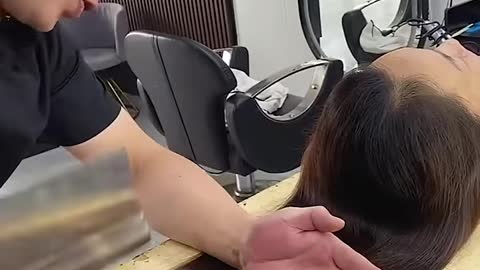 Chopping her hair in a weird way