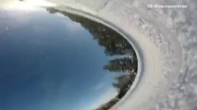 Gopro falls off snowboarders helmet and rolls down slope