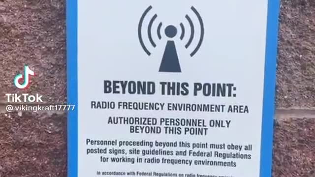 5G tower next to a school. Look at the warning signs.