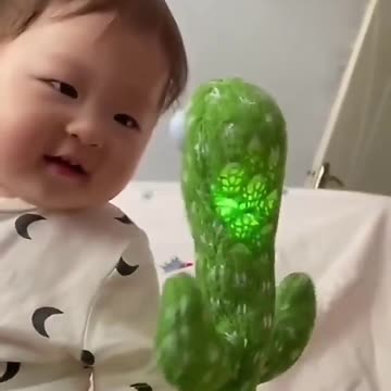 Cute baby play with mimikery toy