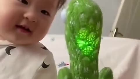 Cute baby play with mimikery toy