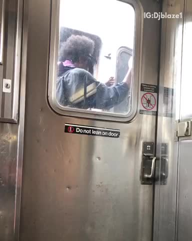 Guy wearing goggles face mask in between subway trains