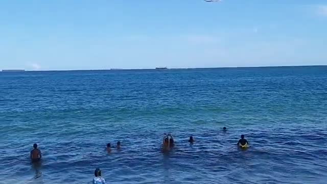 Helicopter boarding over the beach