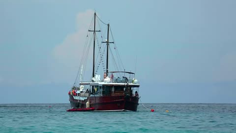 Sailing boat in the middle of the ocean