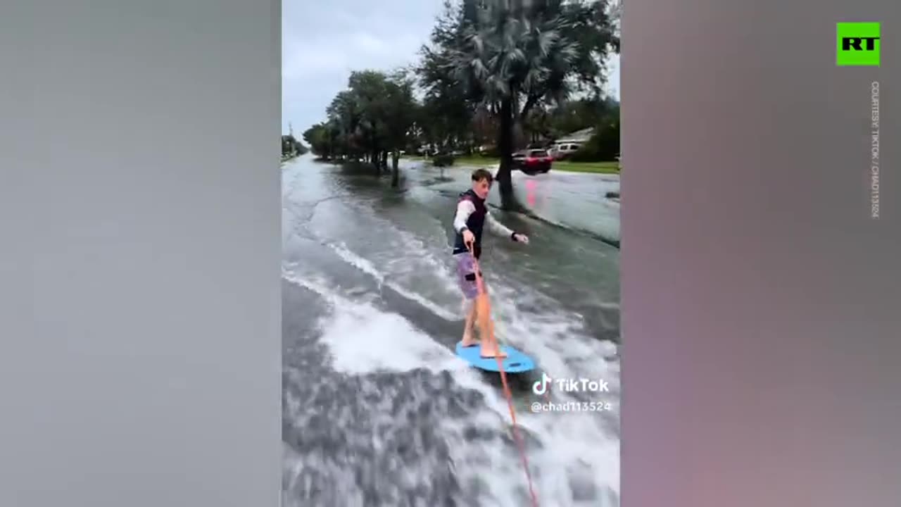 Kids pulled over for surfing through flooded streets