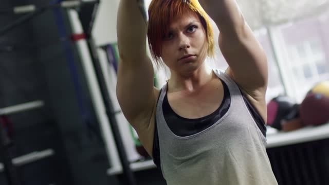 Girl doing kettlebell swing 2