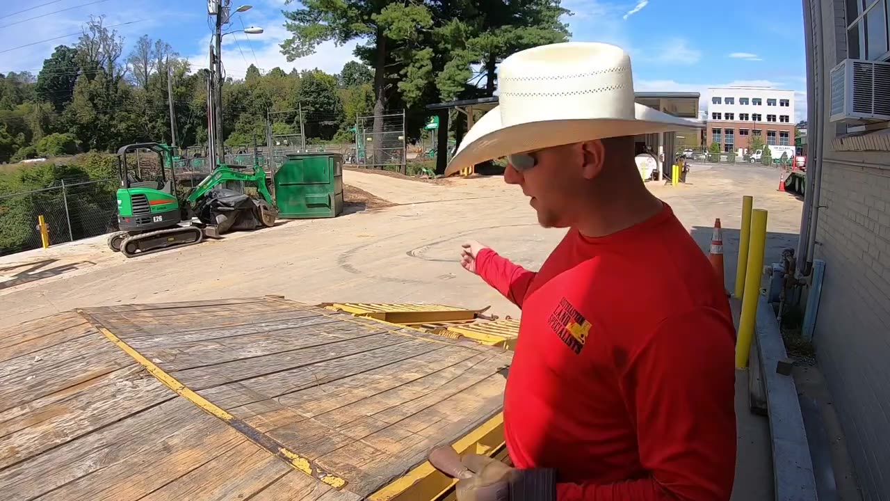 Compacting the gravel driveway