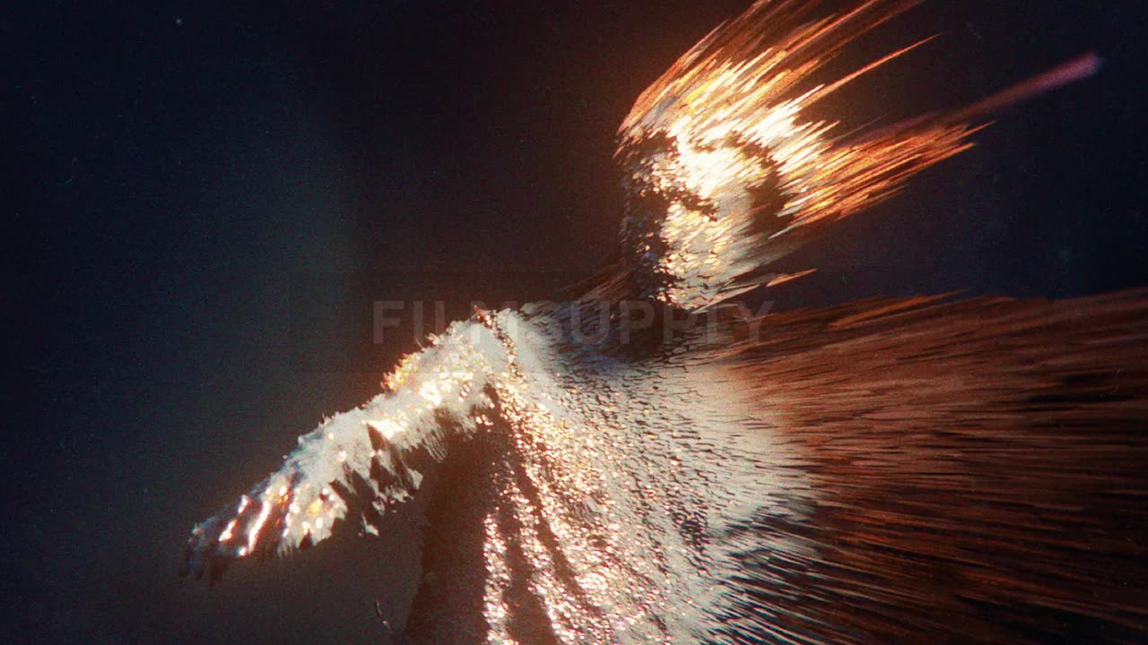 A teenager reaches his hand forward as flames come off his body