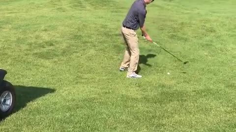 Guy misses two shots hit by golf cart