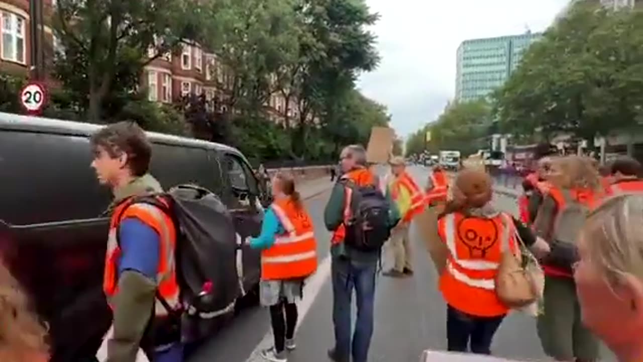 Driver Refuses to Stop for Climate Activists Blocking the Road—Forces His Way Through