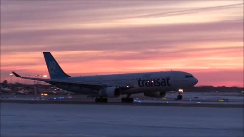 Plane landing at sunset