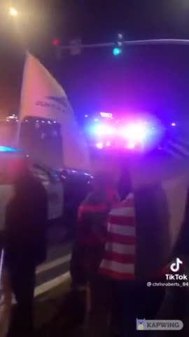 Patriotic Police Signals "Let's Go Brandon" as He Passes by Trump Supporters