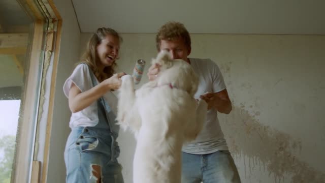 A Happy Family Dancing With Their White Dog 2 🐕‍🦺🐕‍🦺👩🏼‍🤝‍🧑🏽