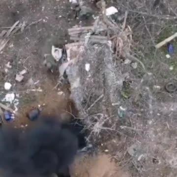Russian soldiers clean a network of trenches.