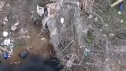 Russian soldiers clean a network of trenches.