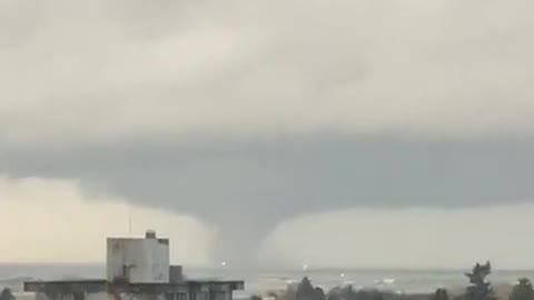 Looks like a large waterspout has started to appear outside Vancouver airport, Canada.