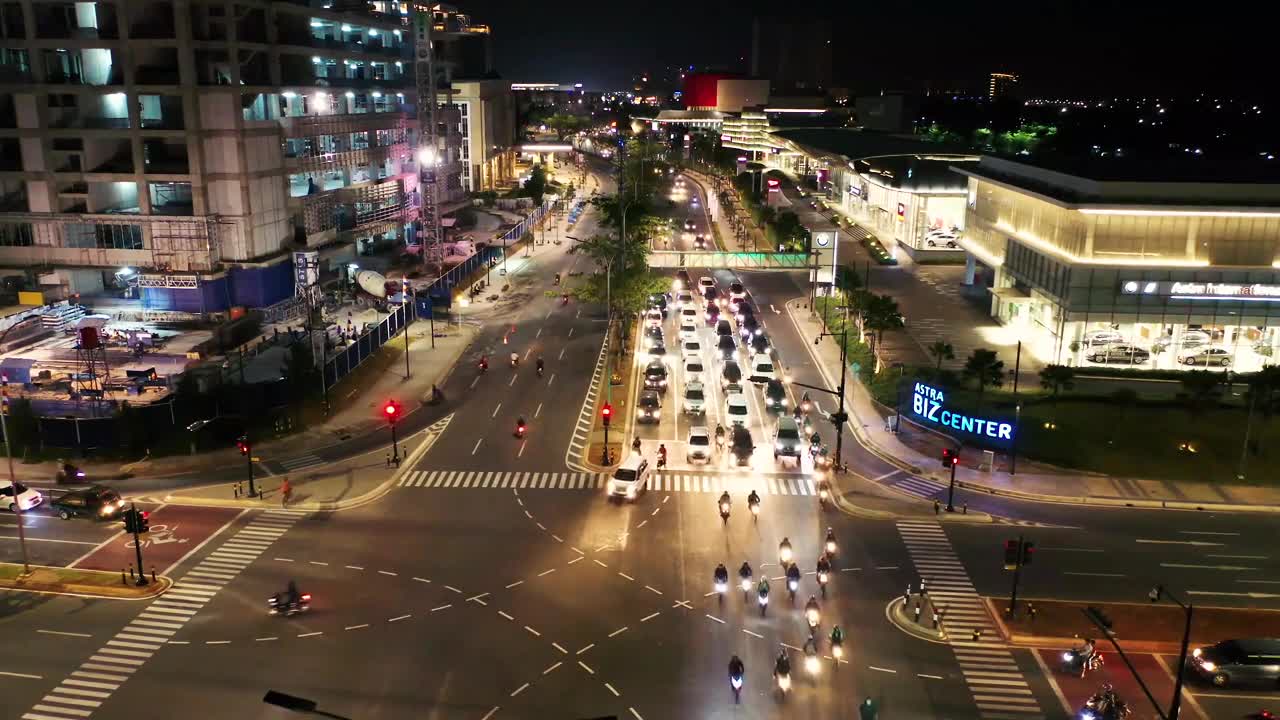 footage of vehicular traffic of a busy street intersection