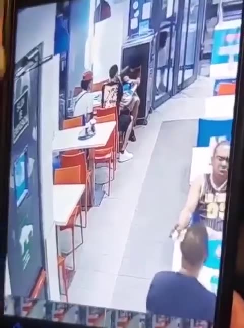 A man Madrid used a Domino's tray to shield himself was shot at