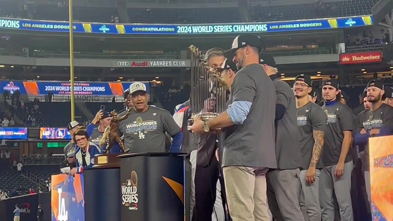 The Dodgers are presented with the World Series trophy.