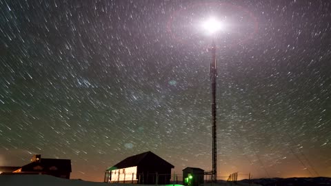 Time-lapse of the moving stars and a tower