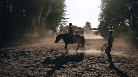 A girl exersicing in horse riding