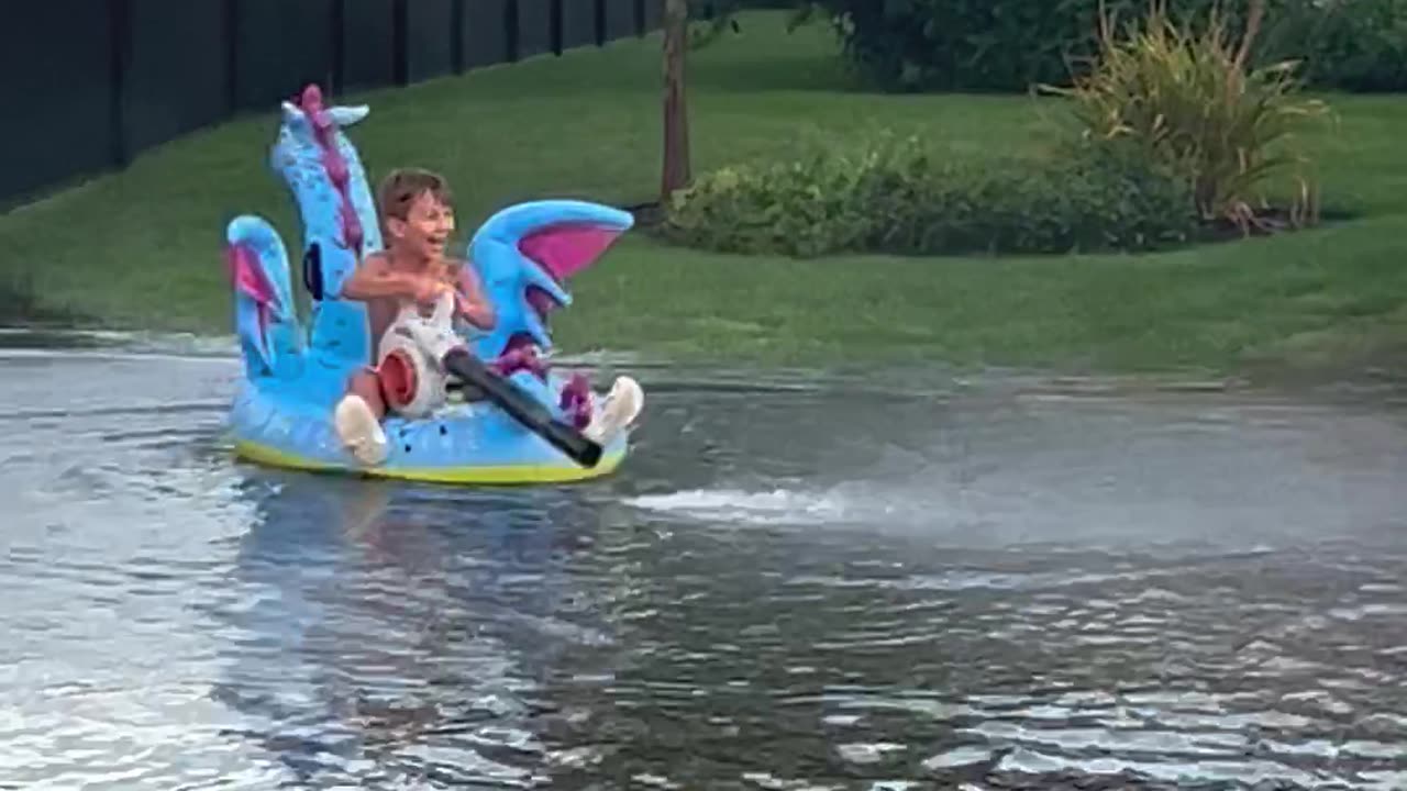 Kids Have Fun in Flooded Street