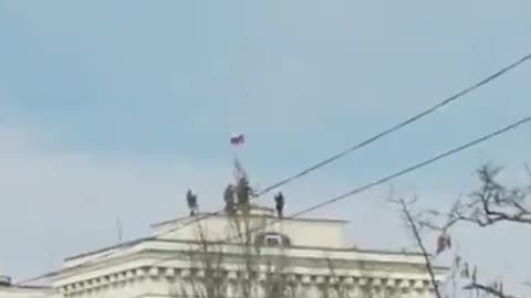 The Russian flag is raised in Kakhovka