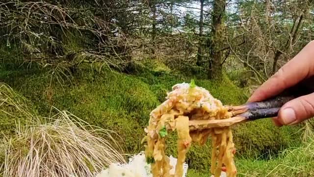 Delicious food made of eggs, flour, onions, garlic and hot peppers cooked in the forest