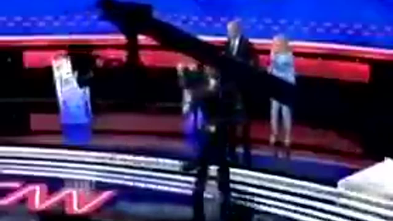 Zoomed in video of Jill Biden leading Joe off the debate stage