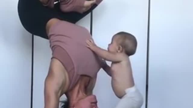 Baby wants to join mother's yoga session