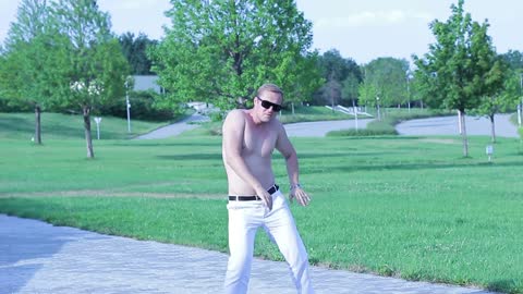 Cheerful happy guy dancing free style on the street