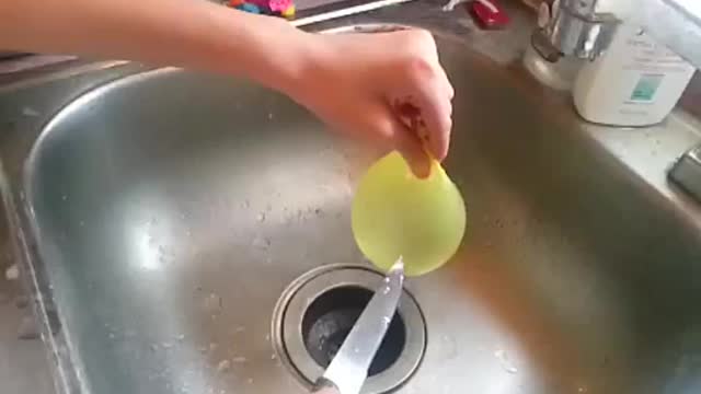 Slow-mo water balloon pop