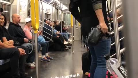 Guy sunglasses yellow hard hat singing subway train door