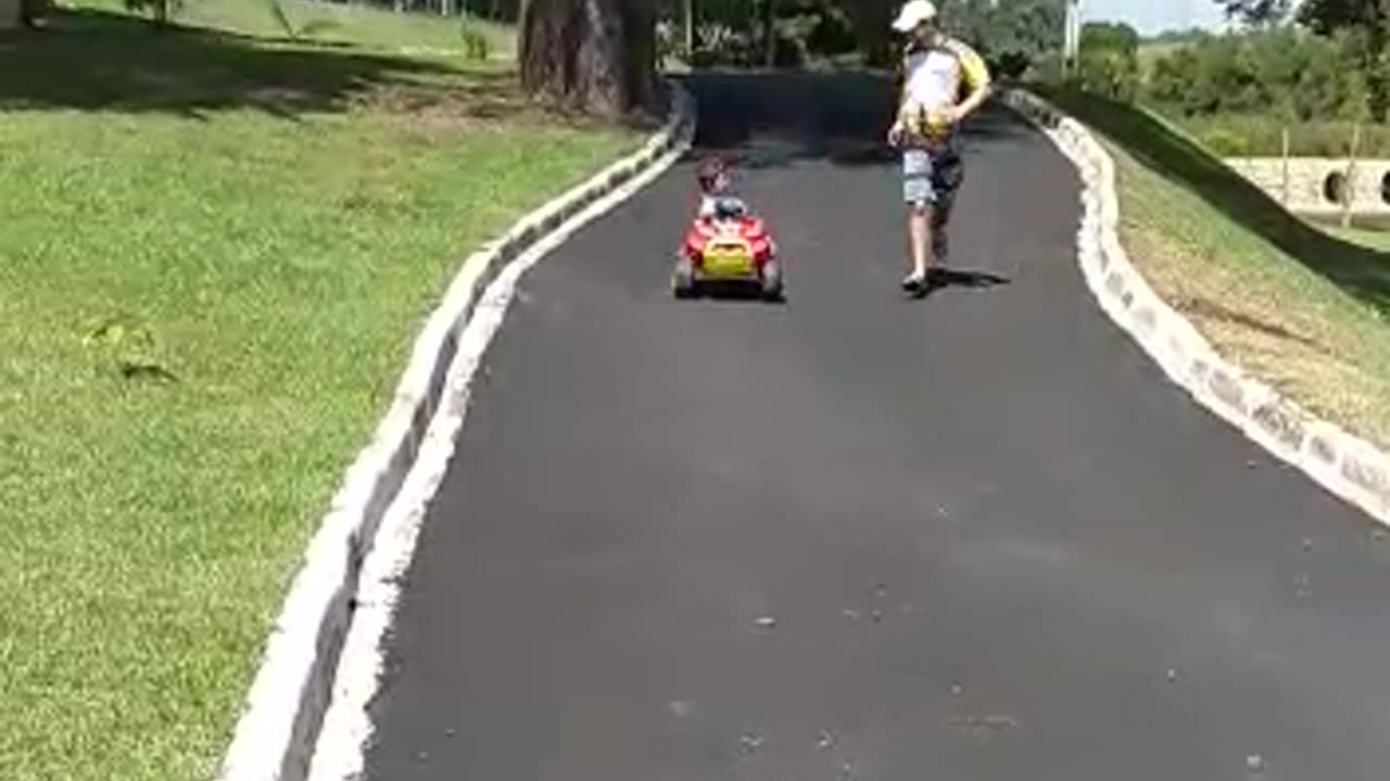 Kid Laughs Down Hill Until Stroller Hits Curb