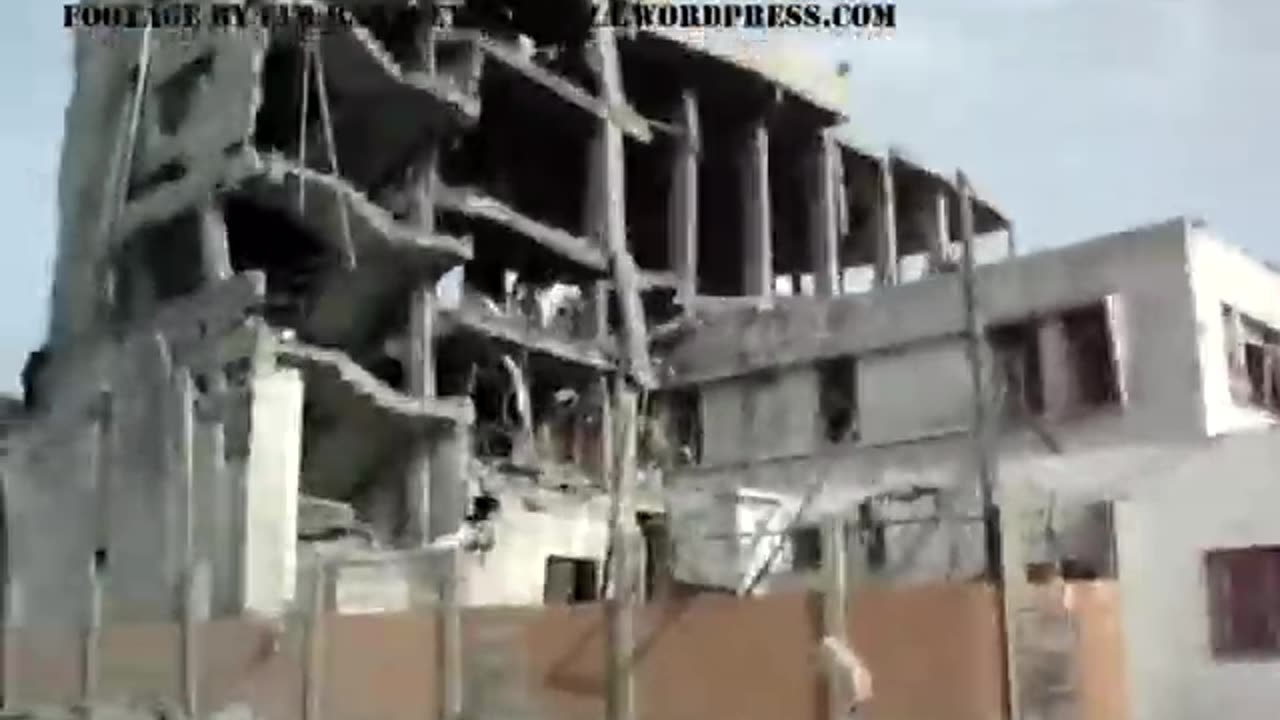 Walking past ruins of buildings in Gaza, Jan 8 2009