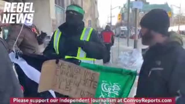 Muslim Person of Color at at Freedom Trucker Rally speaks to Rebel News