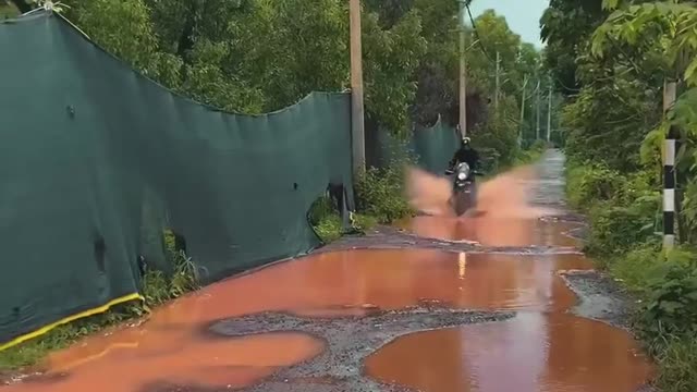 Riding bikes through village road