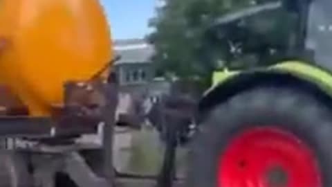 Dutch farmers prepare their own water cannons to wash down the police