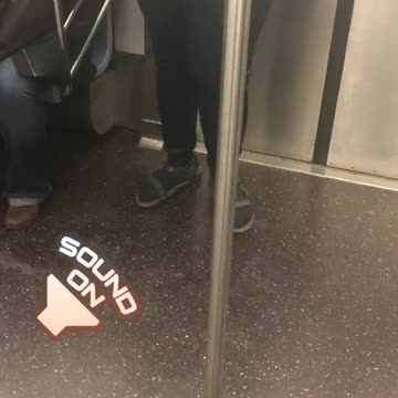 Person with black satchel bag singing loudly on subway
