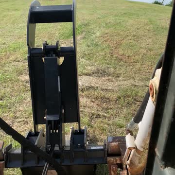 Worlds Largest Wheeled skid steer picking car sized rocks out of the field!
