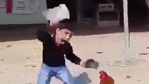 Boy and hen fighting