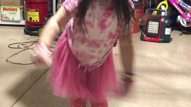 The little one dancing and Papa wrapping up work on the SUV roof tent