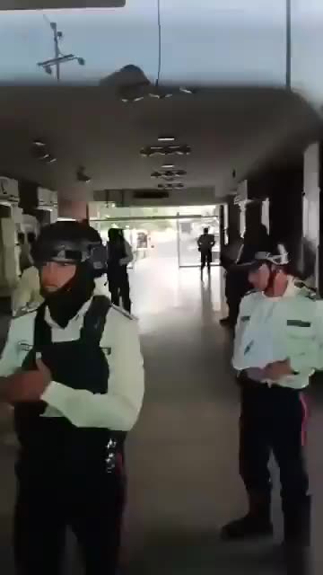 Regional Police Officers, some with Tears in their Eyes, take off their Uniforms