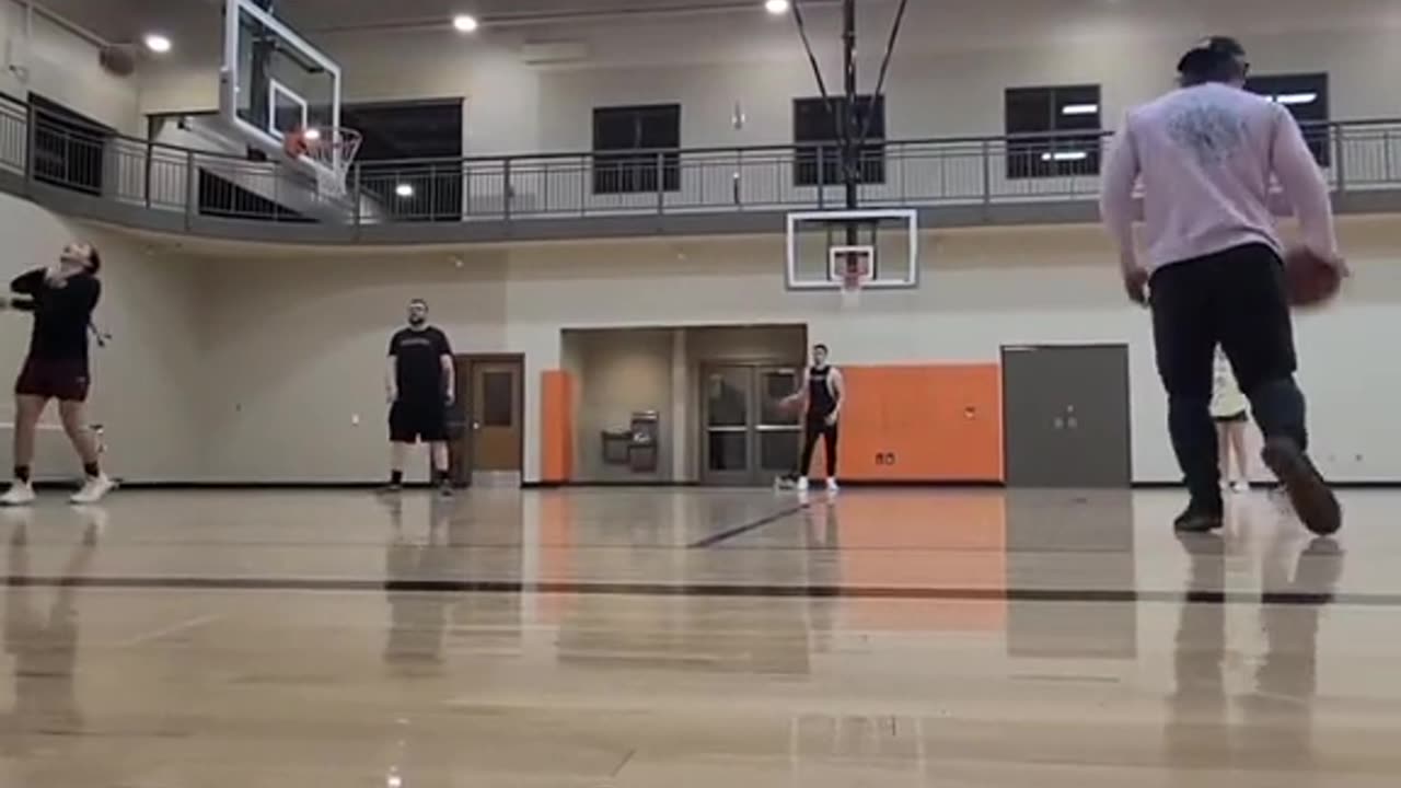 white boy sinks half court shot