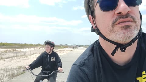 Spencer riding his tricycle at Jones beach air show VID_20230521_132024