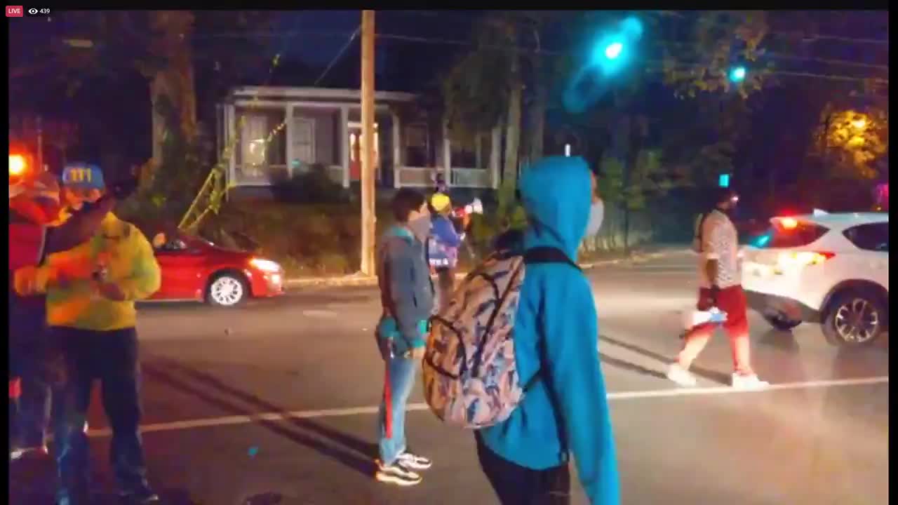 Protesters harass a disabled driver.