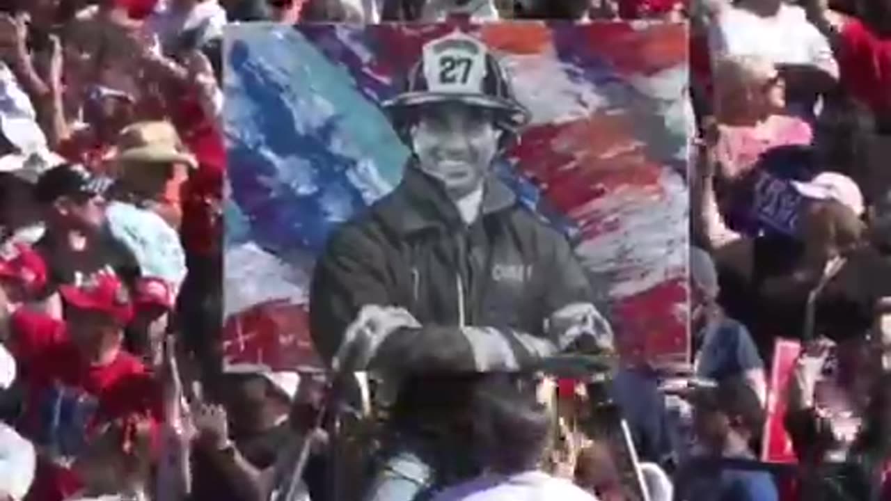 Artist Scott LoBaido unveils his mural of Corey Comperatore at Trump's rally in Butler, PA