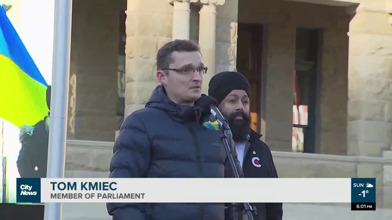 Calgarians gather outside City Hall on Sunday in solidarity with Ukraine