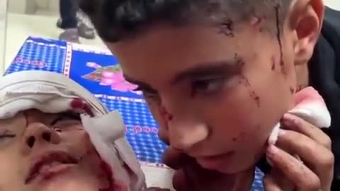 Child teaches his Brother Shahada (prayer you say before dying) in Gaza