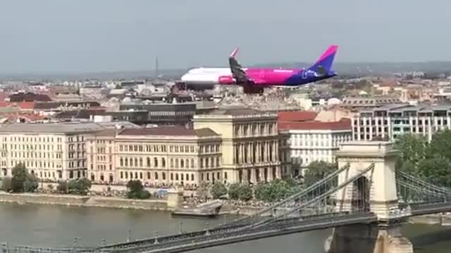 Commercial Plane Flying Low Over Danube River